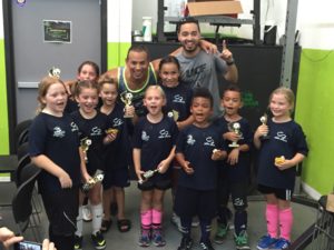 Bri (2nd from left) wins indoor soccer championship (George is one of the coaches!)