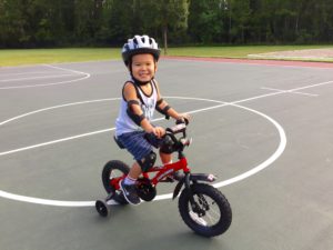 Liam learning to ride! Such a happy boy!!