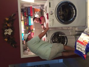 Don and Jeff pulling out the washer and dryer